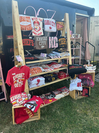 Exterior view of boutique trailer set up at an event